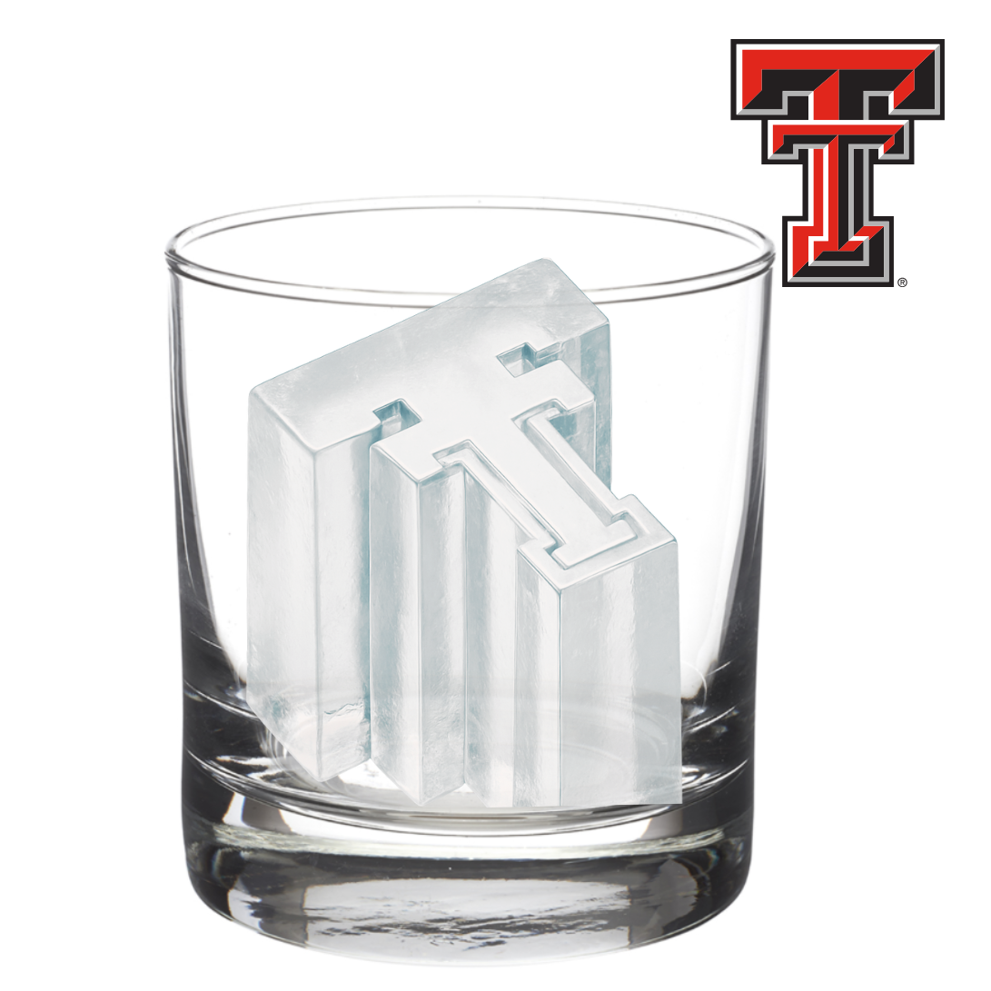 Clear glass with ice cube featuring a logo, next to the Texas Tech logo.